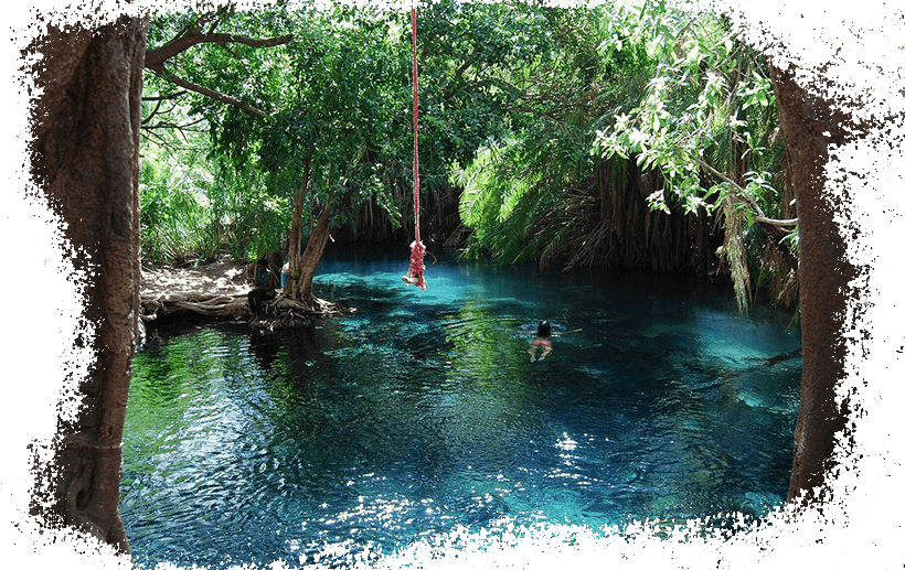 Client swimming in the clear waters of Chemka Hotsprings surrounded by lush greenery